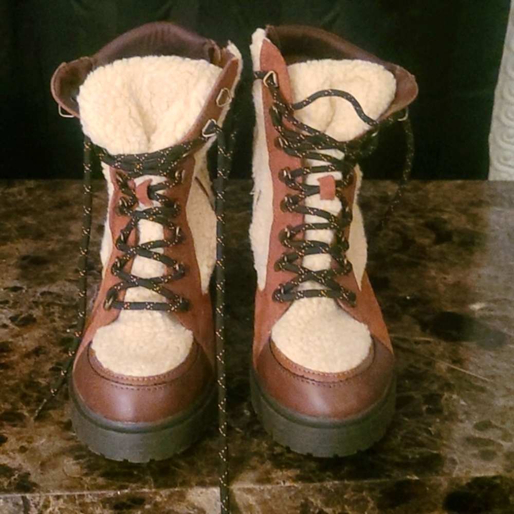 Sun stone multi colored brown rubber sole platform style boots.